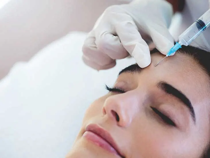 Botulinum (Botox) treatment being administered to a patient